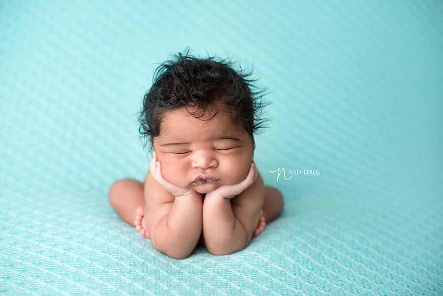 newborn hands in cheeks froggy pose chicago il newborn photographer