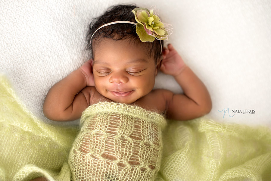 happy newborn baby smiles chicago IL photographer