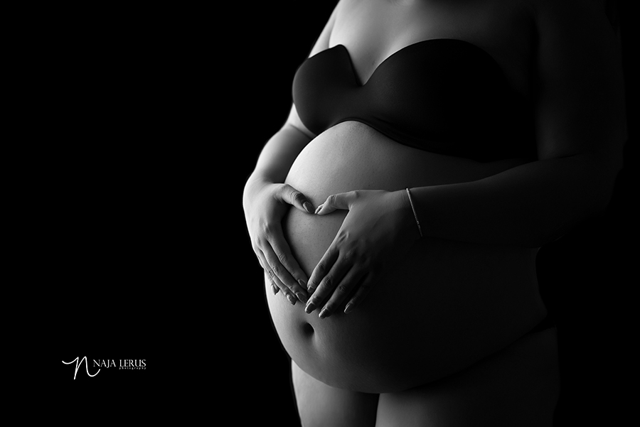 hands on belly maternity picture with hands in shape of a heart