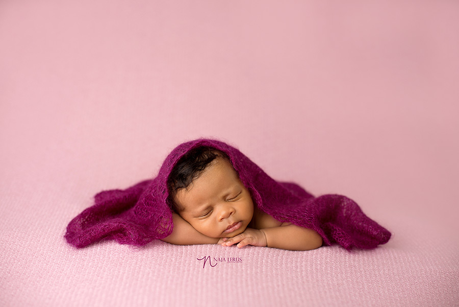 delicate newborn with lace wrap 