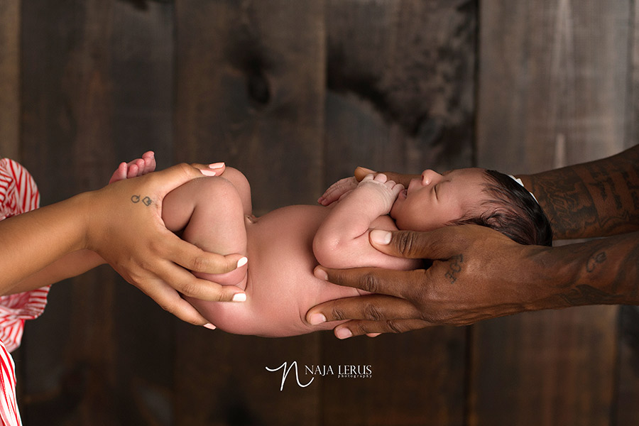 parents holding newborn photography shot chicago iL