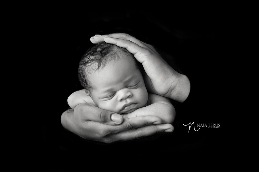 Timeless black and white newborn photography mommy baby in hands