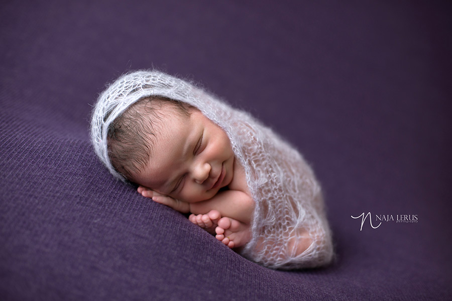 smiling baby newborn pose chicago lace wrap photography