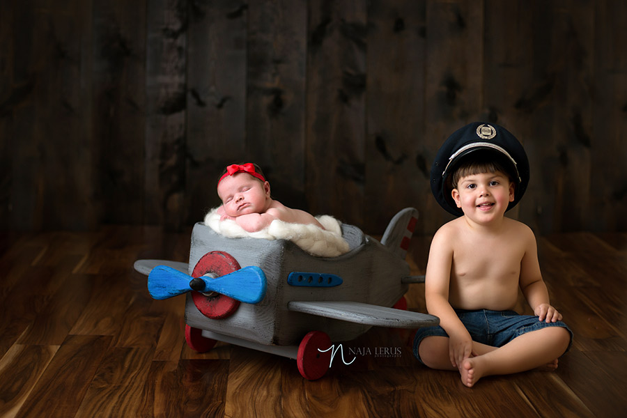 brother sister newborn photography sibling shot airplane prop pilot