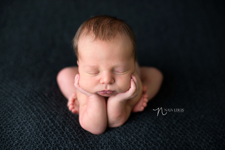 froggy pose newborn photos chicago hands in cheek photographer