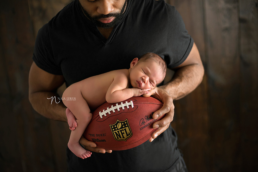 nfl newborn baby on football chicago photographer chicago bears