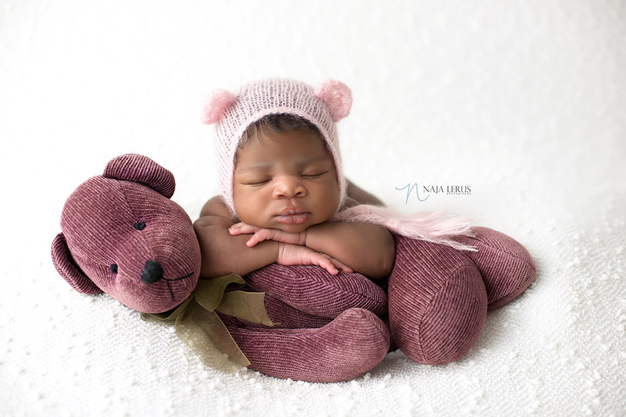 baby on mom teddy bear newborn photography chicago