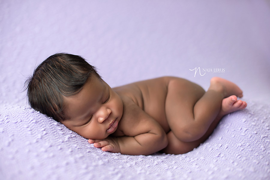 side laying newborn baby chicago posing