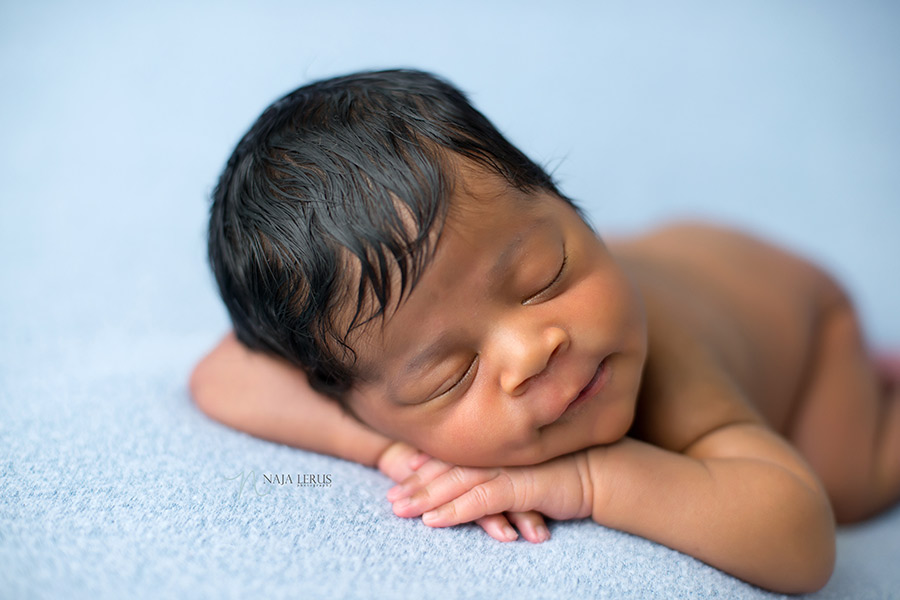 newborn baby smiling in session chicago