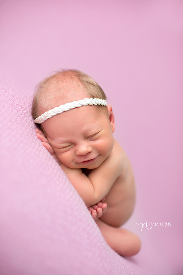 smiling newborn posing chicago IL 