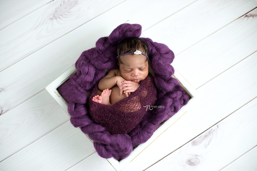 prop shot newborn baby in purple evergreen park IL