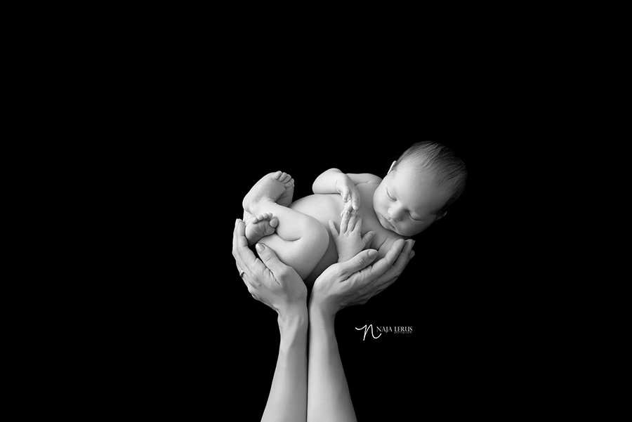 black and white baby in mother's hands newborn portraiture chicago