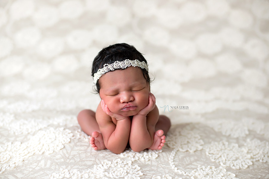 chicago newborn pictures baby hands in cheeks frog pose