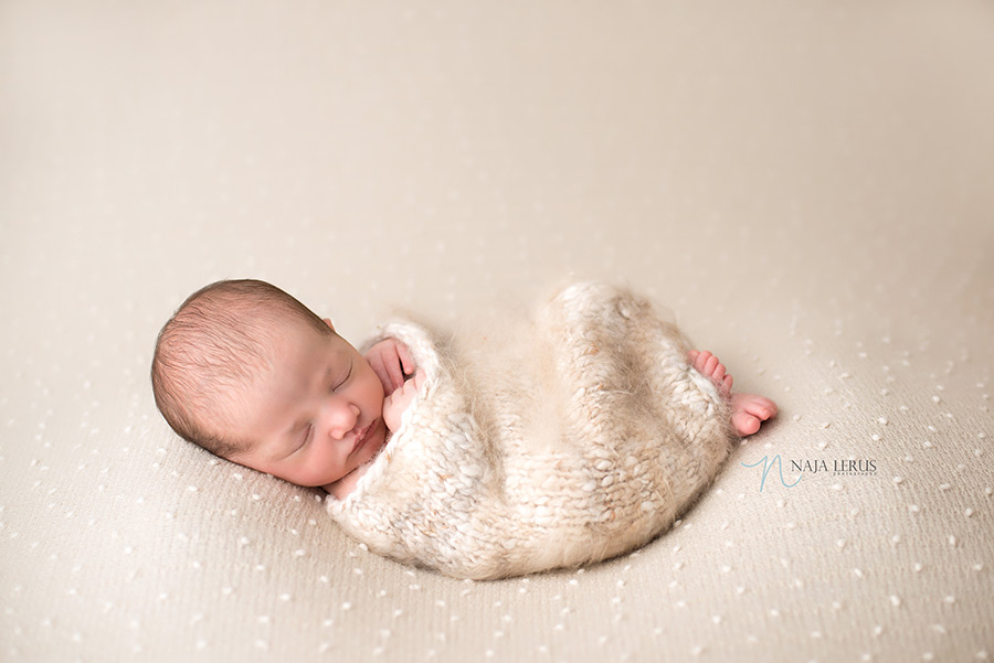 swaddling newborn posing sack chicago IL